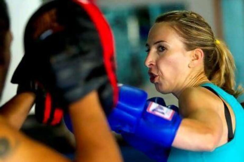 Melanie Swan trains with Nik Taumafai at KO Gym in Dubai's Marina area for her bout at White Collar Fight Night on March 23.