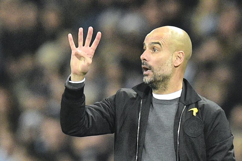 Manchester City's Spanish manager Pep Guardiola gestures on the touchline during the English Premier League football match between Manchester City and Bournemouth at the Etihad Stadium in Manchester, north west England, on December 23, 2017. (Photo by Oli SCARFF / AFP) / RESTRICTED TO EDITORIAL USE. No use with unauthorized audio, video, data, fixture lists, club/league logos or 'live' services. Online in-match use limited to 75 images, no video emulation. No use in betting, games or single club/league/player publications. / 