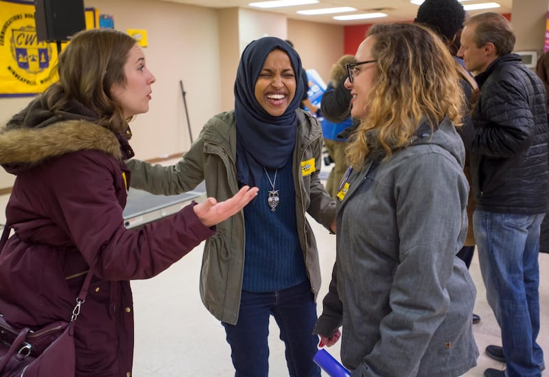 Democrat Ilhan Omar, centre, speaks to supporters while campaigning for US House district 5, in Minneapolis, Minnesota.  EPA