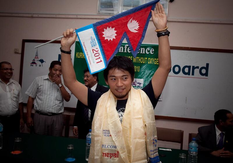 epa06753871 (FILE) - Japanese climber Nobukazu Kuriki holds up the Nepalese national flag during a press conference in Kathmandu, Nepal, 20 August 2010 (reissued 21 May 2018). According to media reports, Kuriki was found dead at Mt Everest Camp II on 21 May 2018.  EPA/NARENDRA SHRESTHA *** Local Caption *** 02293965