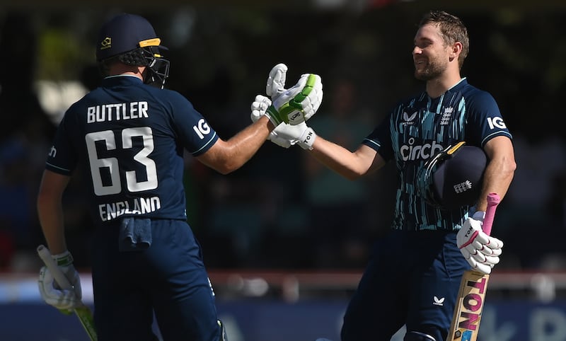 England's Dawid Malan (r) celebrates his century with Jos Buttler. Getty