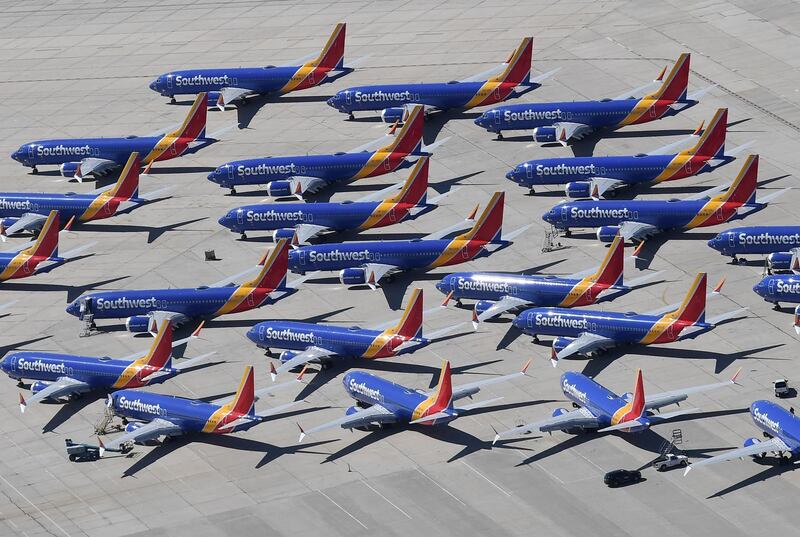 (FILES) In this file photo taken on March 28, 2019 Southwest Airlines Boeing 737 MAX aircraft are parked on the tarmac after being grounded, at the Southern California Logistics Airport in Victorville, California. The Federal Aviation Administration has ordered inspections of Boeing 737 NG aircraft for structural cracks after Boeing discovered the problem on planes undergoing modifications, the agency said on October 2, 2019. The mandate affects 1,911 US-registered aircraft and is expected to require about 165 planes to be inspected within seven days, the agency said. The NG is a precursor plane to the Boeing 737 MAX, which has been grounded since mid-March following two deadly crashes. / AFP / Mark RALSTON
