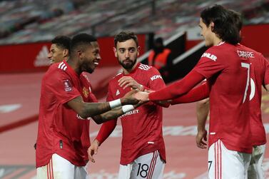 Manchester United's Bruno Fernandes (centre) celebrates after scoring his side's third goal of the game during the Emirates FA Cup fourth round match at Old Trafford, Manchester. PA