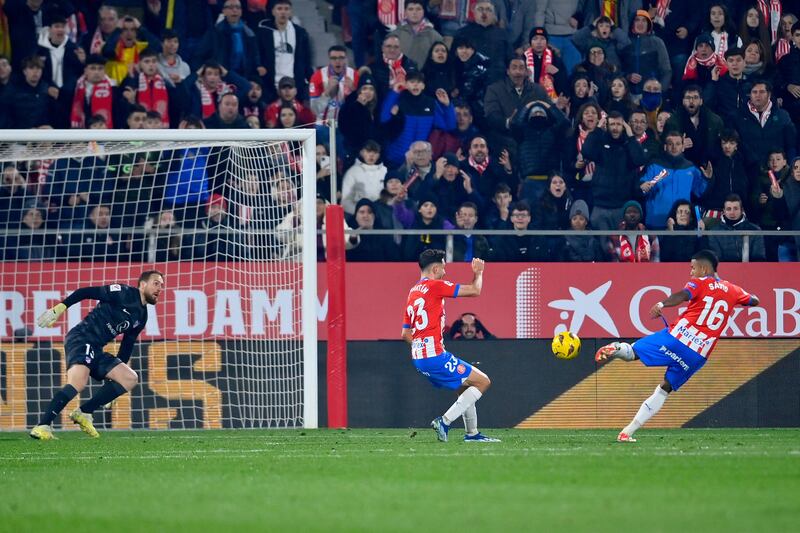 Girona's Savio Moreira scores his team's second goal against Atletico. AFP