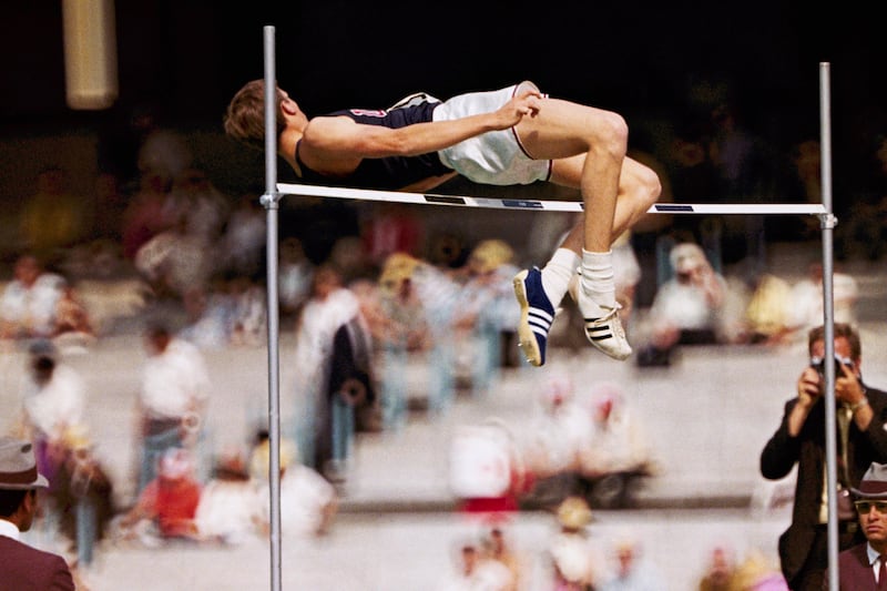 Dick Fosbury clears the bar in the high jump competition at the 1968 Mexico City Olympics, where he won gold. AP