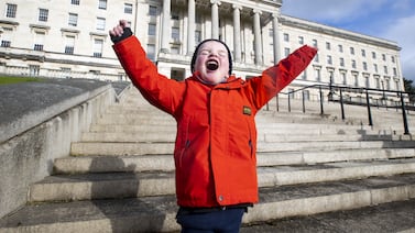 Young organ-donation campaigner Daithi MacGabhann, 6, outside the seat of Northern Ireland's government in Belfast. The region's post-Troubles achievements are a positive example to other societies with deep and sometimes divisive histories. PA