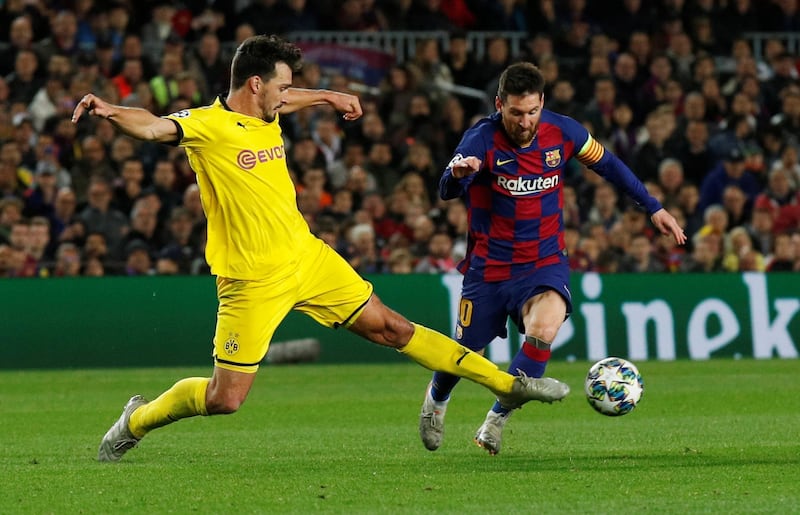 Barcelona's Lionel Messi goes past Borussia Dortmund defender Mats Hummels. Reuters