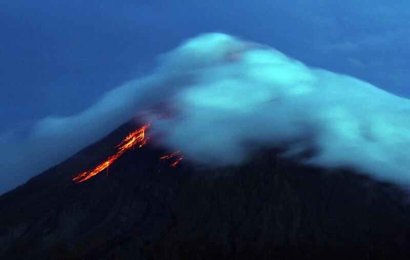 Lava flows from the crater of Mount Mayon volcano seen from Legazpi City, Albay province, southeast of Manila on September 17, 2014. Charism Sayat/AFP Photon

