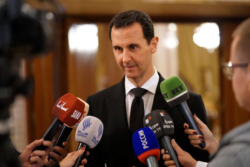 epa06397181 A handout photo made available by the official Syrian Arab News Agency (SANA) shows Syrian President Bashar al-Assad speaking to reporters after a meeting with Russian Deputy Prime Minister, Dmitry Rogozin and a Russian delegation in Damascus, Syria, 18 December 2017. According to SANA, Assad on 18 December met with a Russian official and economic delegation headed by Rogozin to discuss the process of reconstructing destroyed areas in Syria and economic prospects for cooperation between the two countries.  EPA/SANA HANDOUT  HANDOUT EDITORIAL USE ONLY/NO SALES