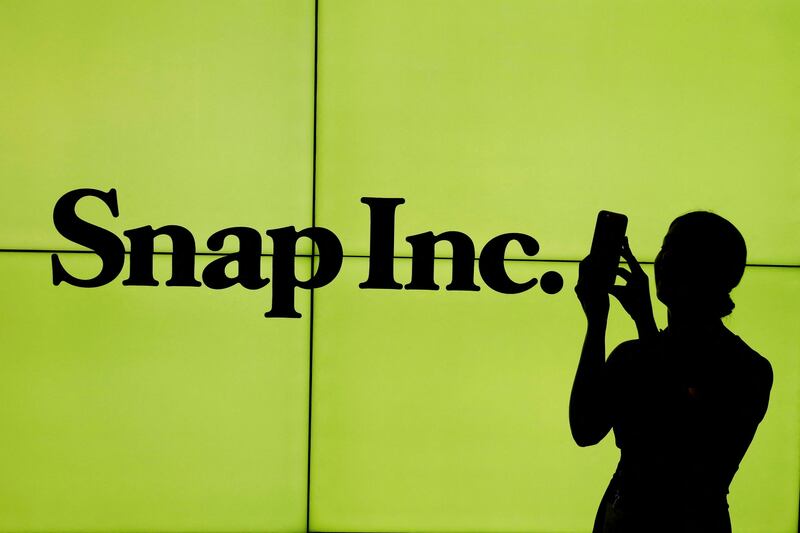 The Snap logo as it appeared on the floor of the New York Stock Exchange. The company's shares have slumped 79 per cent this year and it is making job cuts to address losses. Reuters