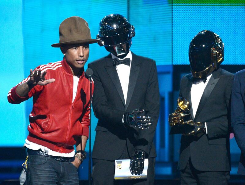 Pharrell Williams, and Thomas Bangalter and Guy-Manuel de Homem-Christo of Daft Punk, accept the Best Pop Duo/Group Performance award for 'Get Lucky' onstage during the 56th Grammy Awards at Staples Center in Los Angeles, California.  AFP