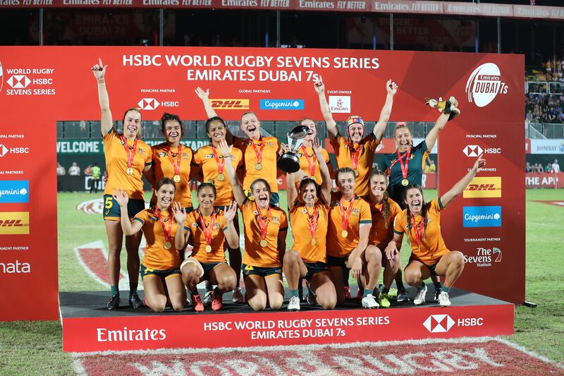 Australia celebrate with the trophy after beating Fiji in the Dubai Sevens final.