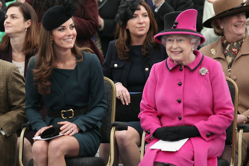 Queen Elizabeth II and Catherine watch a fashion show at De Montfort University, Leicester, in March 2012, during the Queen's Diamond Jubilee tour of the UK