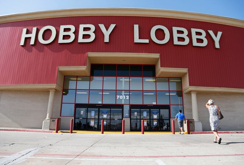 File photo of customers walking into a Hobby Lobby store in Oklahoma City. The company has agreed to pay a $3 million federal fine and forfeit thousands of ancient Iraqi artifacts smuggled from the Middle East that the government alleges were intentionally mislabelled. Sue Ogrocki/AP Photo