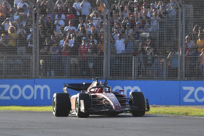 Charles Leclerc acknowledges the crowd during his victory lap after winning the 2022 Formula One Australian Grand Prix. AFP