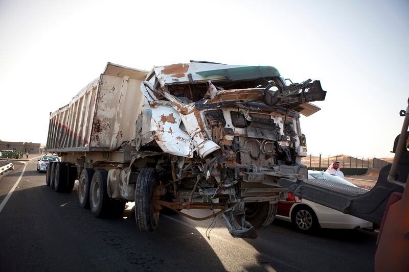 Al Ain, United Arab Emirates, February 4, 2013: 
The remnants of a truck are hauled away from the scene of a tragic traffic accident, which involved a truck and a bus full of laborers and has left 22 people dead and sent many to a hospital, on Monday early evening, Feb. 4, 2013, at the scene of the accident, about 35km from Al Ain on the Abu Dhabi - Al Ain road. The accident happened at 7:30am as the bus, loaded with 45 workers, 95 percent of which were reported Bangladeshi, carried the people to their work at a nearby palace. The bus travelers were employees of the Al Hakeem Decorations and have worked at the palace as maintenance crew.
Silvia Razgova / The National
