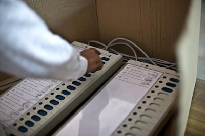 A voter is seen casting his vote on the electronic polling machine in a polling booth in Asia School, Bodakdev area of Ahmedabad, Gujarat India. About 49 per cent of the 3.65 crore electorate today exercised their franchise in the single phase polling in the state's 26 Lok Sabha constituencies on April 30th 2009.