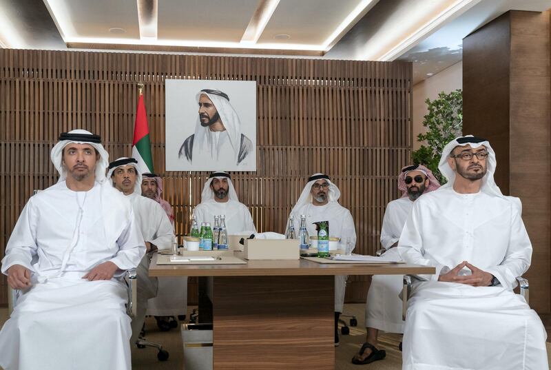 ABU DHABI, UNITED ARAB EMIRATES - March 16, 2020: HH Sheikh Mohamed bin Zayed Al Nahyan, Crown Prince of Abu Dhabi and Deputy Supreme Commander of the UAE Armed Forces (R), receives a briefing via video conference from the Covid19 working group in the HQ of the National Emergency Crisis and Disasters Management Authority (NCEMA) (not shown). 

 Seen with HH Sheikh Tahnoon bin Zayed Al Nahyan, UAE National Security Advisor (2nd R), HH Major General Sheikh Khaled bin Mohamed bin Zayed Al Nahyan, Deputy National Security Adviser, member of the Abu Dhabi Executive Council and Chairman of Abu Dhabi Executive Office (3rd R), HE Mohamed Mubarak Al Mazrouei, Undersecretary of the Crown Prince Court of Abu Dhabi (4th R), HE Ali Saeed Al Neyadi, President and Commissioner of the Customs and Authority (5th R), HH Sheikh Mansour bin Zayed Al Nahyan, UAE Deputy Prime Minister and Minister of Presidential Affairs (6th R) and HH Sheikh Hazza bin Zayed Al Nahyan, Vice Chairman of the Abu Dhabi Executive Council (L). 

( Mohamed Al Hammadi / Ministry of Presidential Affairs )
---