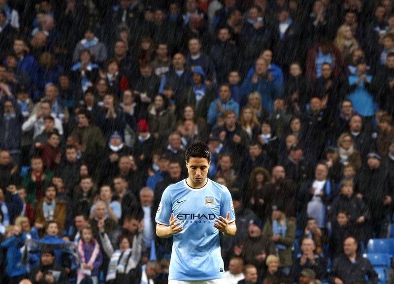 Manchester City midfielder Samir Nasri prays before the match against Aston Villa on Wednesday. Darren Staples / Reuters / May 7, 2014