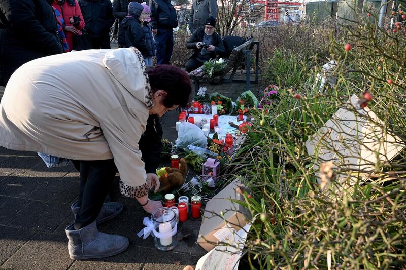 epa08097718 Mourning people place candles, notes and flowers at the entrance outside of the zoo in Krefeld, Germany, 01 January 2020. All animals, in total more than 30, died during the fire at the Krefeld Zoo ape house in the New Year's night. The dead animals include chimpanzees, orangutans and two older gorillas. The criminal police in Krefeld currently assume that so-called sky lanterns may have set the monkey house on fire on New Year's Eve. According to reports, eye-witnesses had seen sky lanterns land on the roof of the building.  EPA/SASCHA STEINBACH
