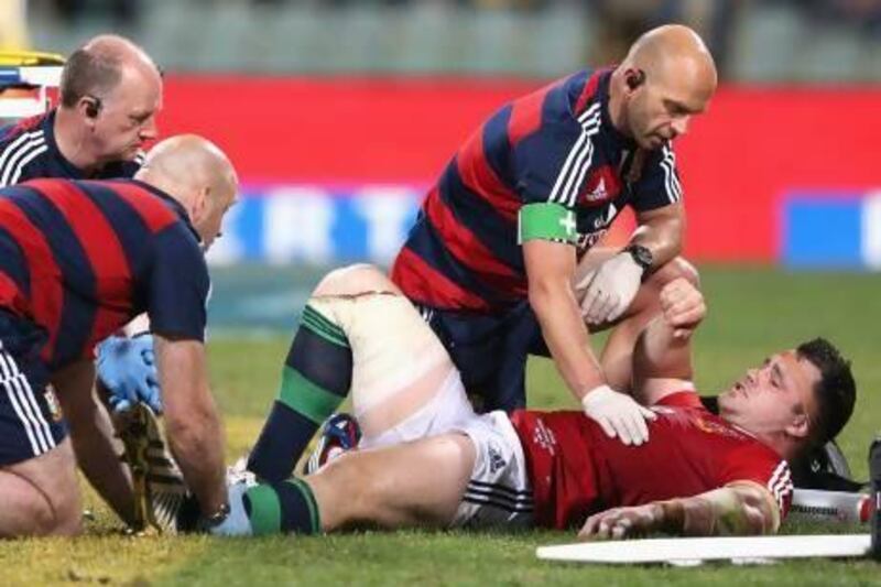Cian Healy of the Lions is treated for a leg injury that may end his tour. Healy is also facing a disciplinary issue for allegedly biting a Western Force player.