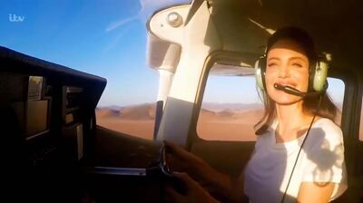 Angelina Jolie fying a plane in The Queen's Green Planet. Courtesy ITV