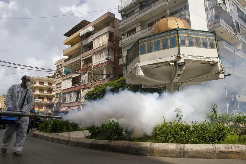 A monument depicting the Dome of the Rock mosque in the southern Lebanese city of Sidon is fumigated. AFP