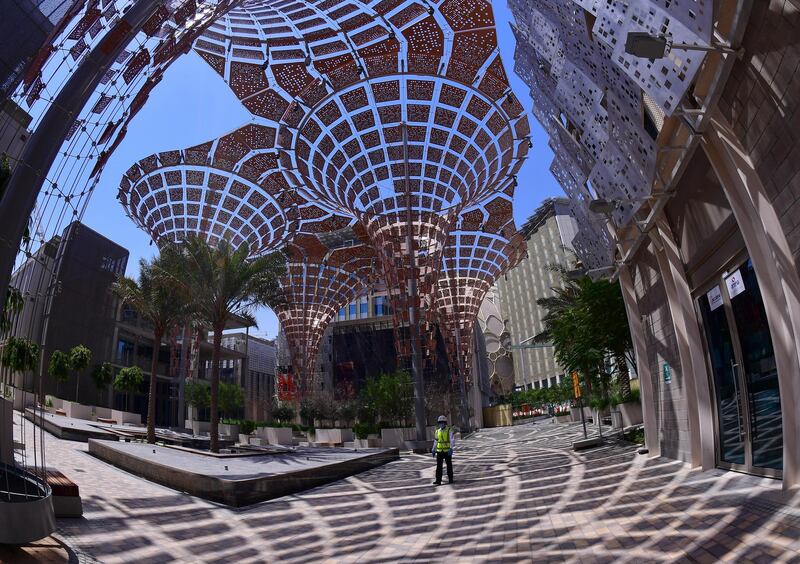 This photo taken with a fisheye lens on June 14, 2020, shows a partial view of the Dubai Expo 2020 site, under construction in the Emirati city. - Armies of workers in protective masks are racing to complete the mammoth Dubai Expo 2020 site despite the coronavirus that has sickened some workers, forced a one-year postponement, and created a logistical headache.
The six-month world fair, a milestone for the emirate which has splashed out 8.2 billion dollars on the eye-popping venue in the hope of boosting its soft power and resetting the economy, will now open its doors in October 2021. (Photo by GIUSEPPE CACACE / AFP)