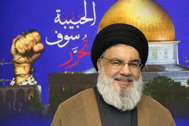 A handout picture released by Hezbollah's al-Manar TV on June 23, 2022 shows the chief of Lebanon's Iran-backed group Hasan Nasrallah (R) posing for a picture during a meeting at an undisclosed location.  - Hamas leader Ismail Haniyeh arrived in Beirut on June 21, for meetings aimed at "strengthening cooperation and fraternity between the Palestinian and the Lebanese people", a Hamas statement said.  (Photo by Al-Manar  /  AFP)  /  === RESTRICTED TO EDITORIAL USE - MANDATORY CREDIT "AFP PHOTO  /  HO  /  HEZBOLLAH'S AL-MANAR TV" - NO MARKETING - NO ADVERTISING CAMPAIGNS - DISTRIBUTED AS A SERVICE TO CLIENTS ===