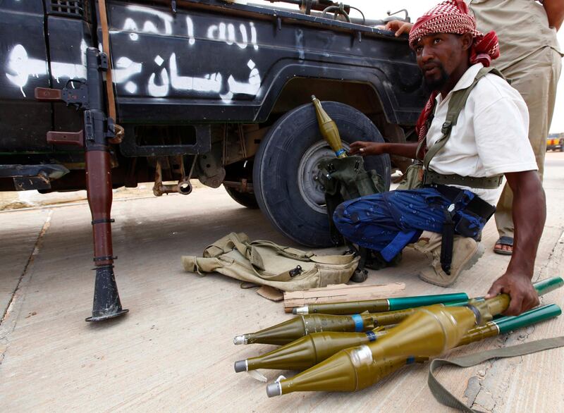 Fighters loyal to Libya's transitional leaders prepare RPGs in an area about 5 km (3 miles) from the centre of Muammar Gaddafi's hometown Sirte before an assault on the city September 20, 2011. In the latest reverse in weeks of chaotic fighting over Sirte, Gaddafi's birthplace and one of the last remaining bastions of his support, five anti-Gaddafi fighters were killed on Tuesday after they came under artillery fire.  REUTERS/Anis Mili   (LIBYA - Tags: MILITARY POLITICS CIVIL UNREST CONFLICT) *** Local Caption ***  ANIS07_LIBYA-_0920_11.JPG