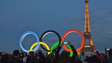 FILE - The Olympic rings are set up on Trocadero plaza that overlooks the Eiffel Tower, a day after the official announcement that the 2024 Summer Olympic Games will be in the French capital, in Paris, Thursday, Sept.  14, 2017.  The organizers of the Paris Games say the Olympic rings will be displayed on the Eiffel Tower.  The five-ring creation is 29-meters long and 15-meter high, made entirely of recycled steel, the Games organizers said in a statement Monday April, 8, 2024.  (AP Photo /  / Michel Euler, File)