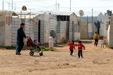 Syrian children play in the Zaatari refugee camp, 80 kilometres north of the Jordanian capital, Amman. The UAE's vaccine drive will inoculate 12,000 people in the Emirati-Jordanian camps of Mrajeeb Al Fhood, Zaatari, Al Azraq and Al Hadiqa. AFP