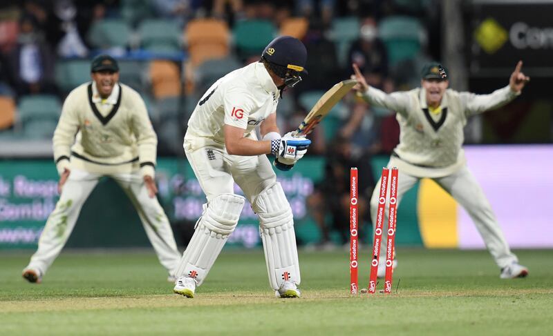 England batsman Ollie Pope is clean bowled by Australia's Pat Cummins for five. PA