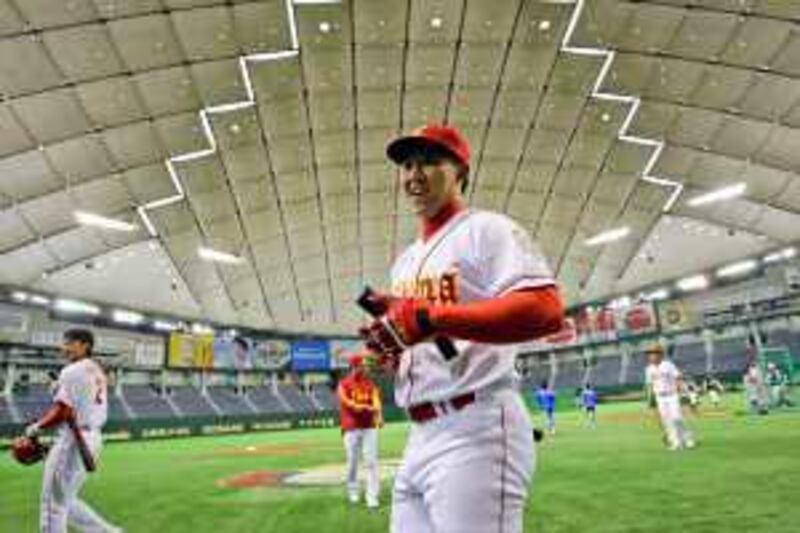 China's shortstop Chang Ray with teammates during practice before the World Baseball Classic.