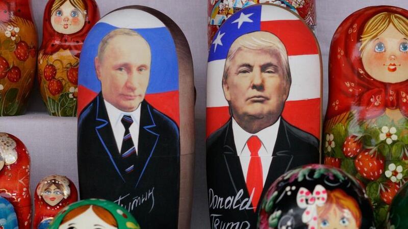 Russian Matryoshka dolls depicting Russian President Vladimir Putin and US President Donald Trump are seen on sale at Izmailovo flea market in Moscow. AFP