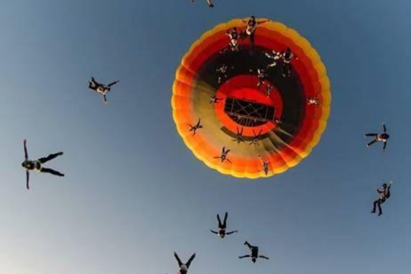Skydive Dubai broke records when 40 people parachuted from a single balloon, 25 of which jumped at the same time. Courtesy of Skydive Dubai