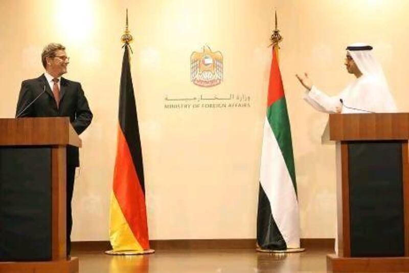 Sheikh Abdullah bin Zayed and Guido Westerwelle, the German foreign affairs minister, discuss the Syrian reconstruction plan in Abu Dhabi yesterday.