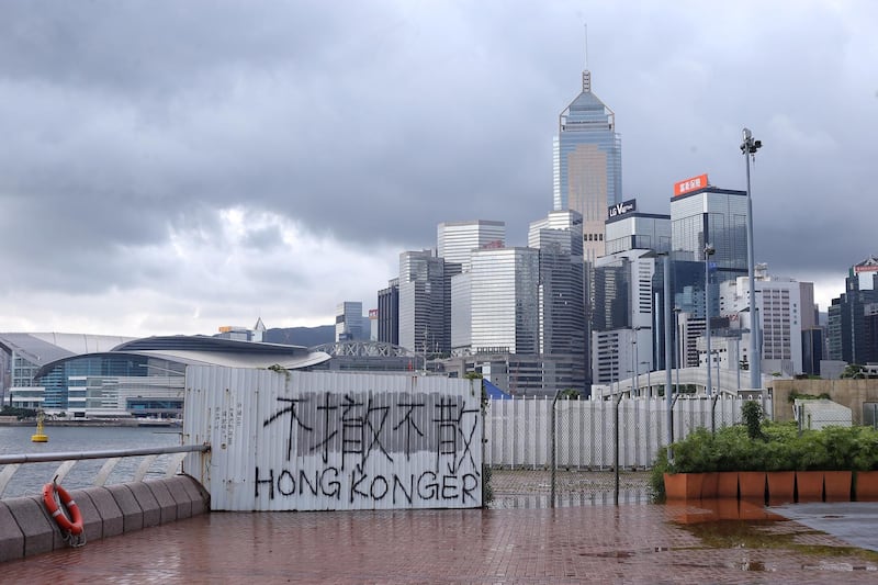 A view of graffiti by protesters that says 'no retraction, no dispersal' on a fence outside a plot of land, which was just transferred to the People's Liberation Army (PLA), on the Victoria Harbour waterfront in Hong Kong, China.  EPA