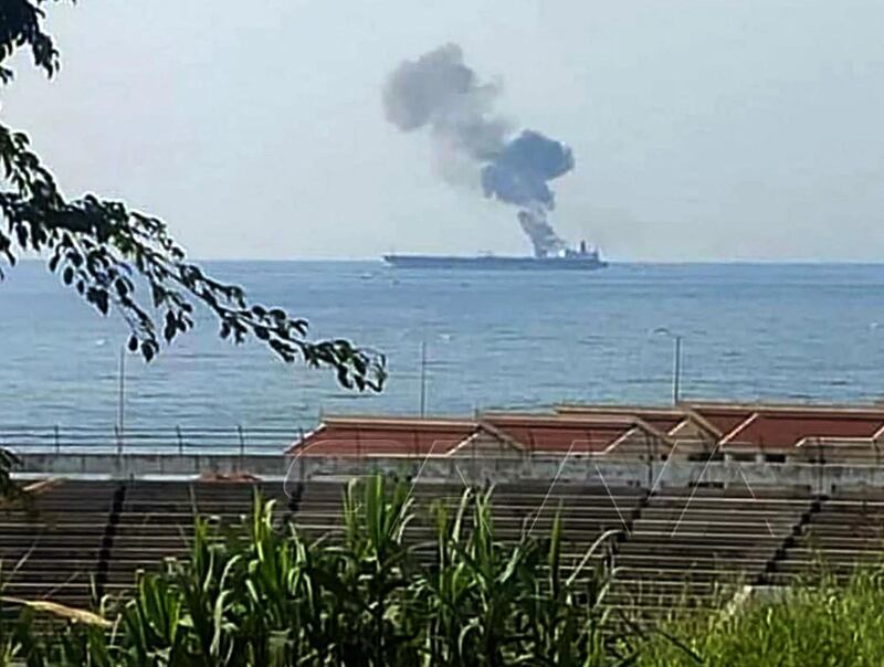 A handout picture released by the official Syrian Arab News Agency (SANA) on April 24, 2021, shows smoke billowing from a tanker off the coast of the western Syrian city of Baniyas. - An Iranian tanker was attacked off the Syrian coast, sparking a fire, the Britain-based Syrian Observatory for Human Rights said, while state news agency SANA quoted the oil ministry as saying the fire erupted after "what was believed to be an attack by a drone from the direction of Lebanese waters". (Photo by - / SANA / AFP) / == RESTRICTED TO EDITORIAL USE - MANDATORY CREDIT "AFP PHOTO / HO / SANA" - NO MARKETING NO ADVERTISING CAMPAIGNS - DISTRIBUTED AS A SERVICE TO CLIENTS ==