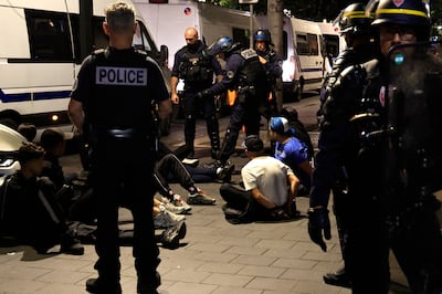 Police detain suspects on a street in Nice. AFP