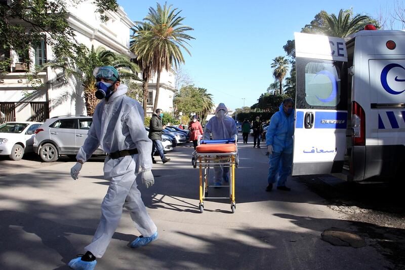 Medical workers arrive at the Mustapha Pacha hospital in Algiers. The Algerian government has decided on Monday to extend for an additional period of 15 days the partial lockdown measure in 34 provinces as from Dec. 2, said a statement from the Prime Minister's services. The extension is part of measures to manage and curb the health crisis caused by the COVID-19. AP