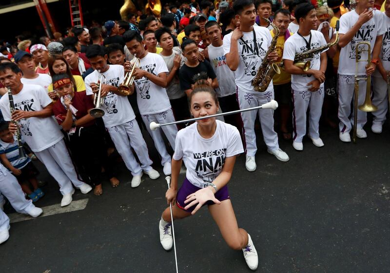 Catholic devotees celebrate as they wait to touch the statue of the Black Nazarene. Reuters