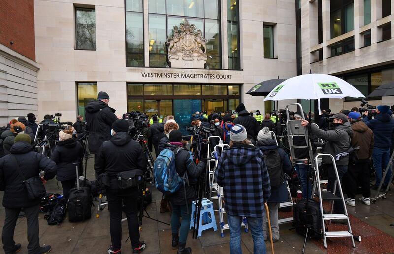 Members of the media and supporters of Julian Assange gather outside Westminster Magistrates court. AFP