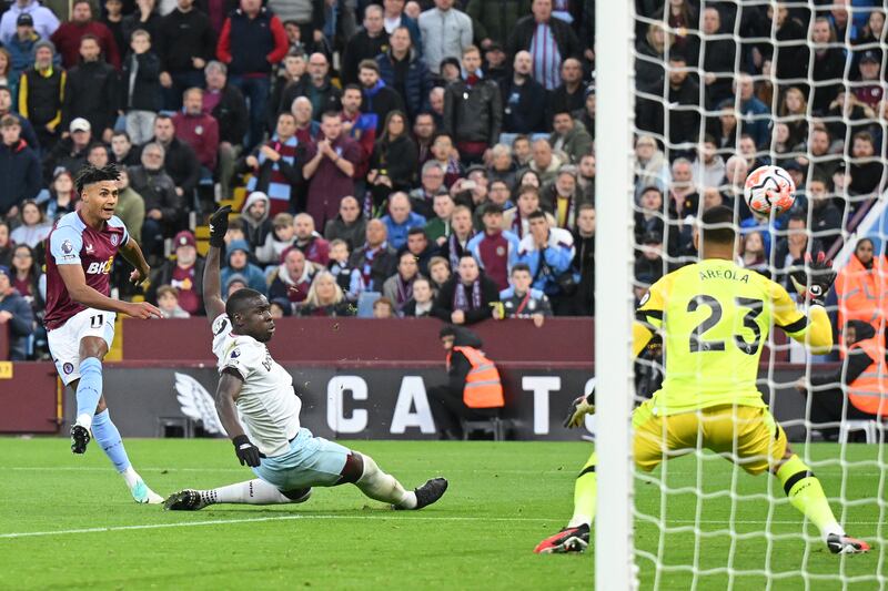 Ollie Watkins of Aston Villa scores their third goal past Alphonse Areola of West Ham United. Getty