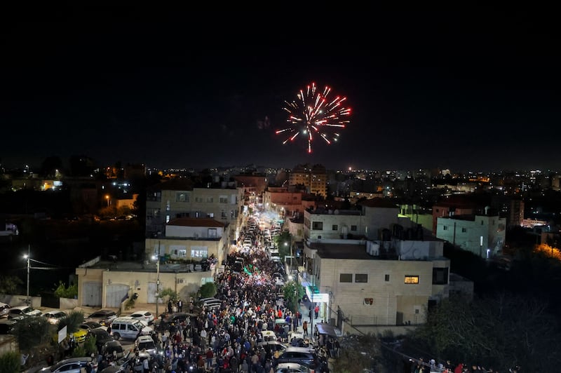 Fireworks light up the sky as Palestinians celebrate the release of the detainees, in the occupied West Bank. AFP