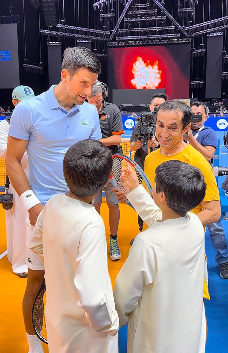 Sheikh Saeed and Novak Djokovic talk to young tennis fans at the World Tennis League in Dubai. Photo: Dubai Sports Council