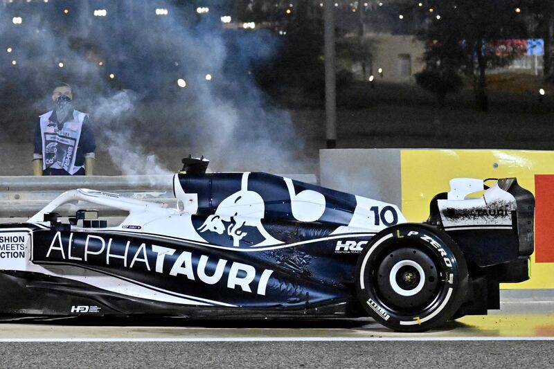 Smoke billows from AlphaTauri's French driver Pierre Gasly's car after it caught fire. AFP