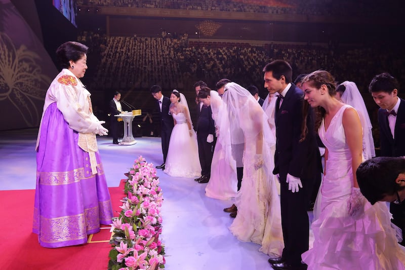 South Korean Han Hak-Ja, wife of the late controversial Rev Moon Sun-myung weds all the couples.  Chung Sung-jun / Getty Images