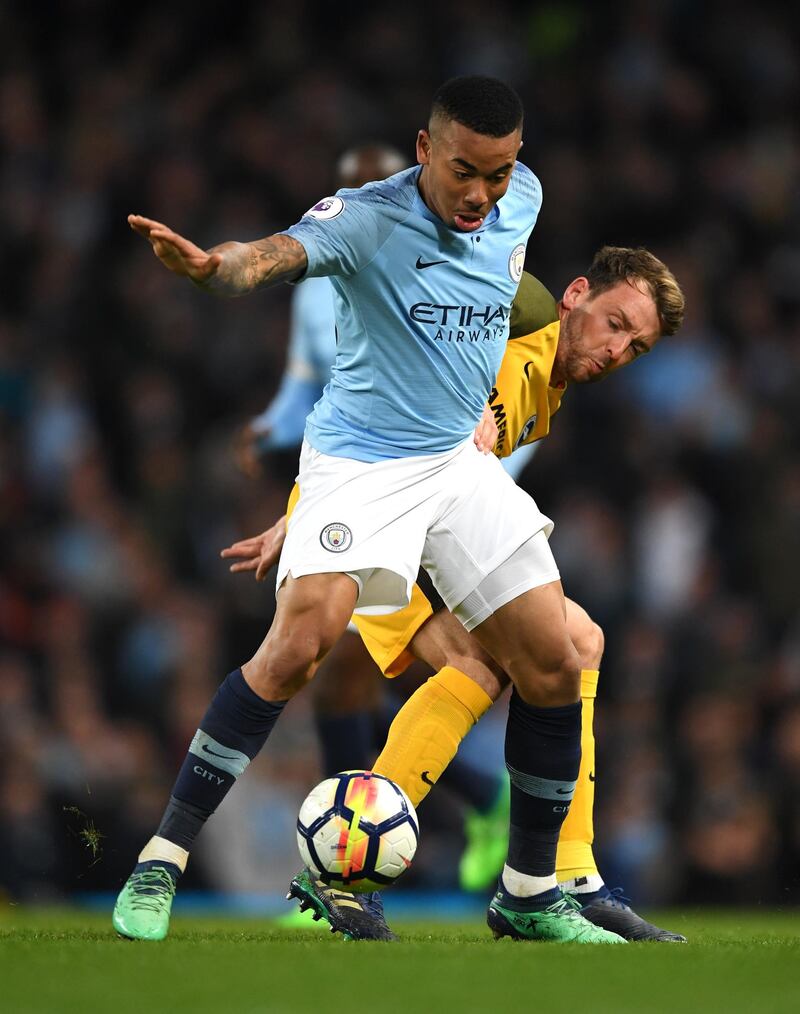 MANCHESTER, ENGLAND - MAY 09: Gabriel Jesus of Manhester City  is challenged by Dale Stephens of Brighton and Hove Albion during the Premier League match between Manchester City and Brighton and Hove Albion at Etihad Stadium on May 9, 2018 in Manchester, England.  (Photo by Gareth Copley/Getty Images)