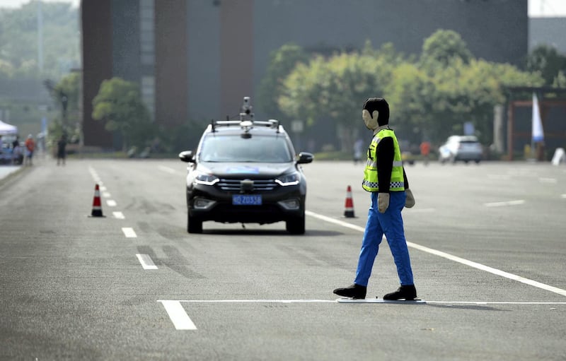CHONGQING, CHINA - AUGUST 18: An unmanned automobile competes in the i-VISTA (Intelligent Vehicle Integrated Systems Test Area) Autonomous Driving Challenge on August 18, 2018 in Chongqing, China. The Intelligent Vehicle Integrated Systems Test Area (i-VISTA) in Chongqing provided a simulated city environment for over 20 teams to compete in two aspects including APS challenge and AEB challenge. (Photo by VCG/VCG via Getty Images)
